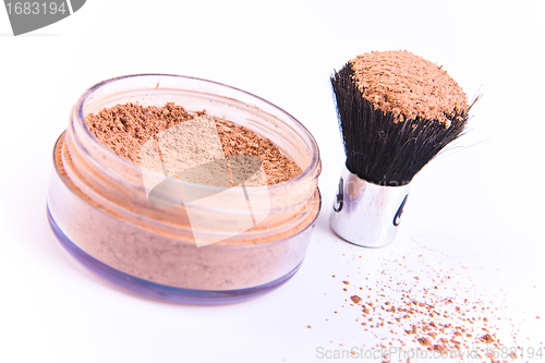 Image of makeup brush and powder