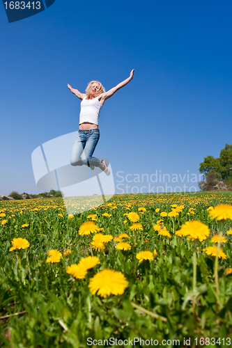 Image of happy young woman on meadow