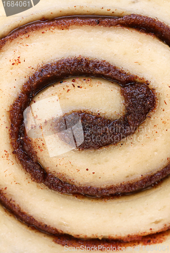 Image of Macro of cinnamon bun swirl with selective focus on center.
