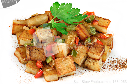 Image of Stacked Home Fried Potatoes on a white background.