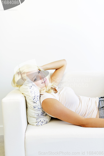 Image of Woman lying on couch