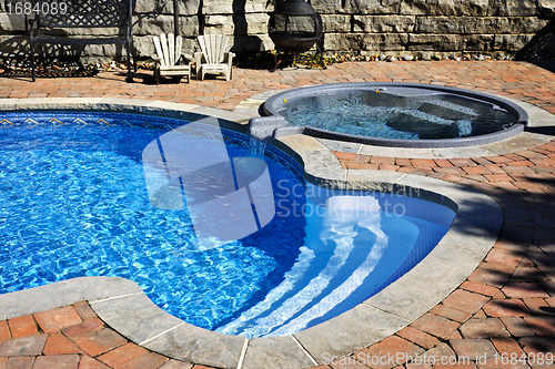 Image of Swimming pool with hot tub