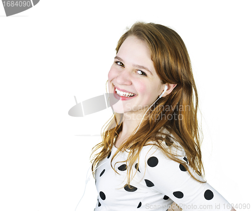 Image of Teenage girl listening to music