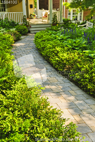 Image of Stone path in landscaped home garden