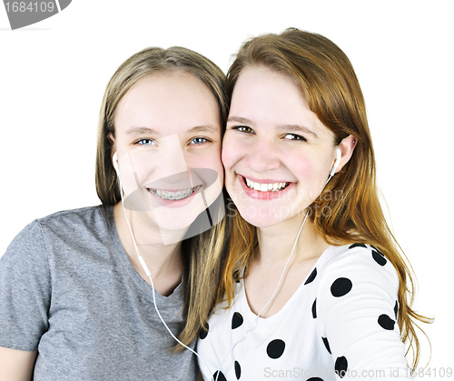 Image of Two teenage girls listening to music