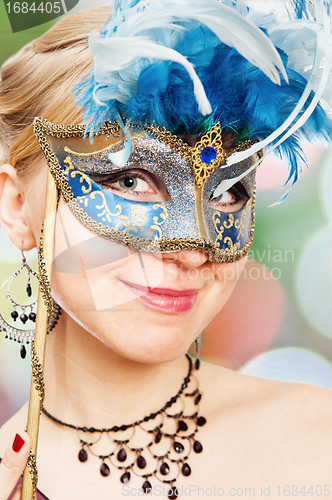 Image of young woman in Carnival mask