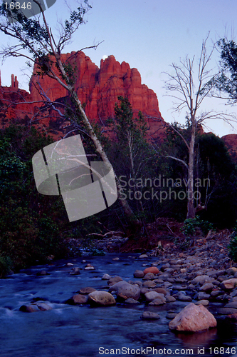 Image of sunset on redrocks as moon rises