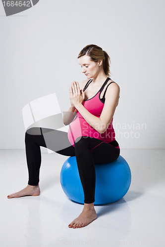 Image of Pregnant woman meditating