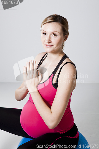 Image of Pregnant woman meditating