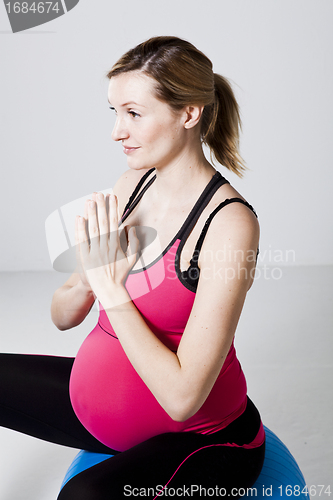 Image of Pregnant woman meditating