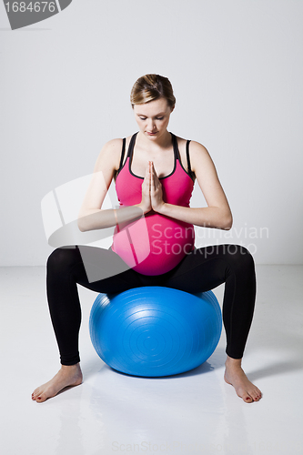 Image of Pregnant woman meditating