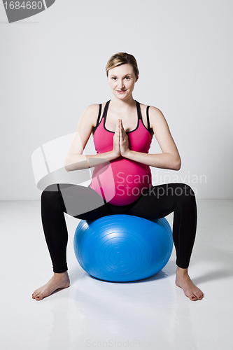 Image of Pregnant woman meditating