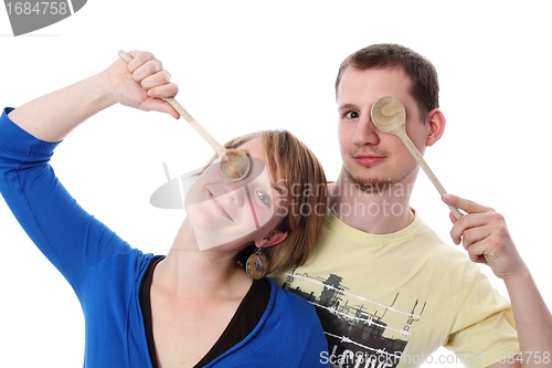 Image of Couple with two wooden spoons