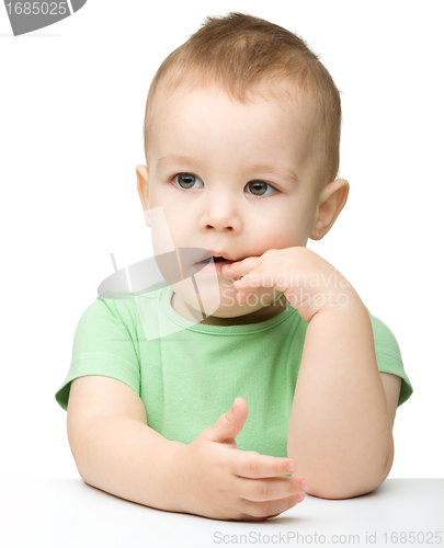 Image of Portrait of a cute and pensive little boy