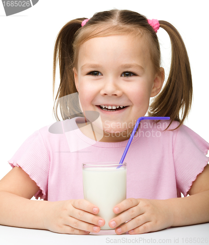 Image of Cute little girl with a glass of milk