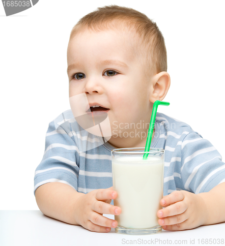 Image of Cute little boy with a glass of milk