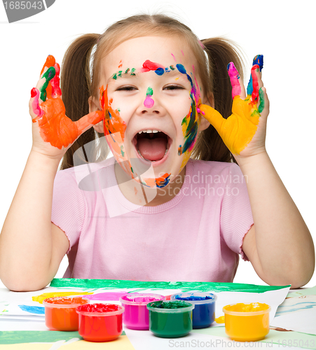 Image of Cheerful girl with painted hands