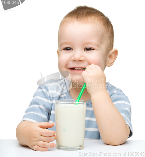 Image of Cute little boy with a glass of milk