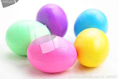 Image of children paint colorful easter eggs