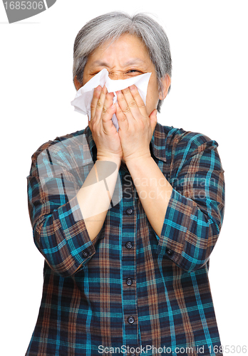 Image of sneezing mature asian woman