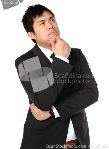 Image of young asian business man thinking