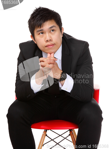 Image of young asian business man thinking