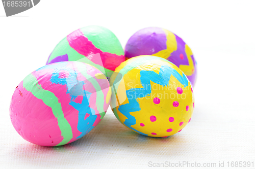 Image of children paint colorful easter egg