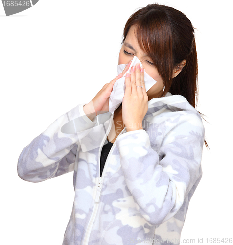 Image of sick woman blowing nose