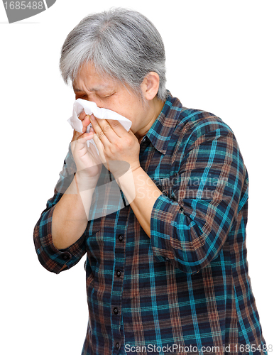 Image of mature asian woman sneezing