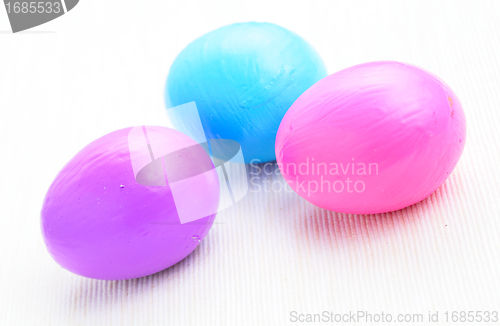 Image of children paint colorful easter egg