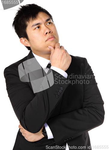 Image of young asian business man thinking