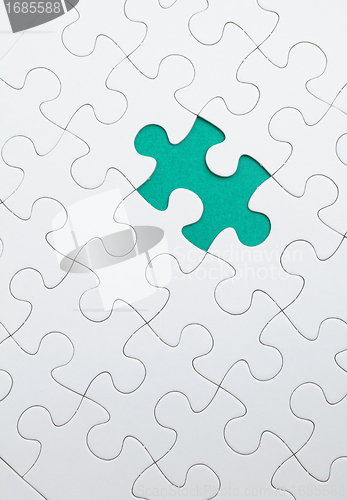 Image of puzzle with green piece missed