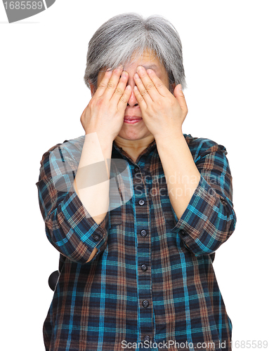 Image of middleage asian woman cover eyes