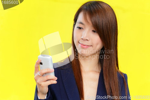 Image of asian woman using mobile phone