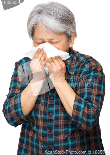 Image of mature asian woman sneezing