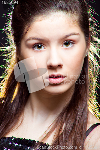 Image of beautiful  teenager girl with long dark hair on black