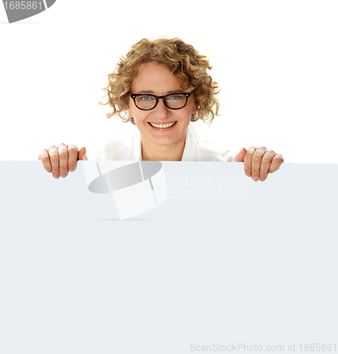 Image of Female business professional holding blank billboard