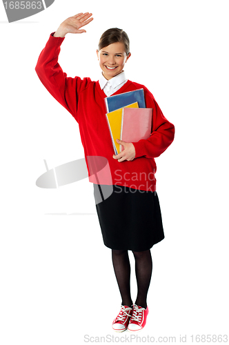 Image of Full length view of student girl with giving hi5