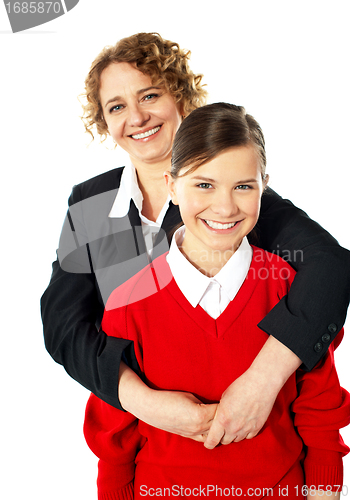 Image of Teacher embracing her student from back