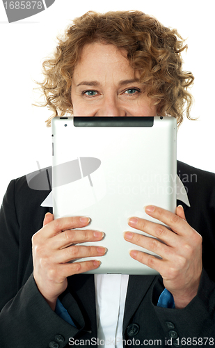 Image of Corporate lady hiding her face with ipad