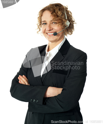 Image of Smiling female operator with crossed arms