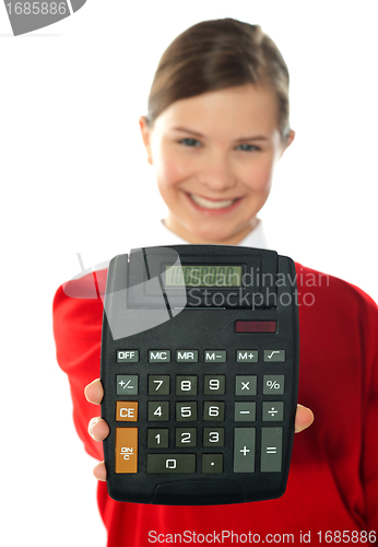 Image of Smiling school girl showing digital calculator