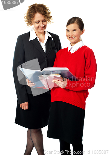 Image of Beautiful child with teacher, shot in studio