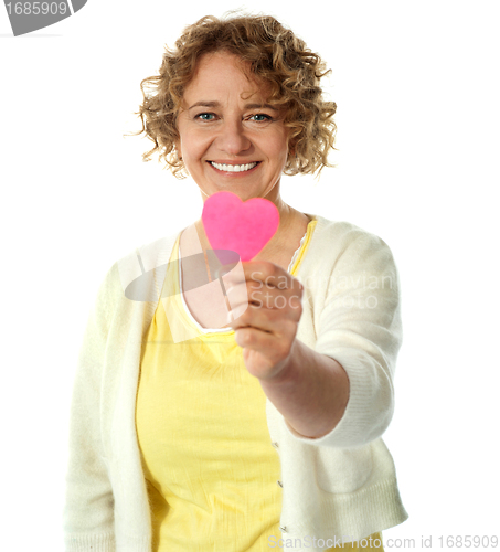 Image of Happy woman offering her heart