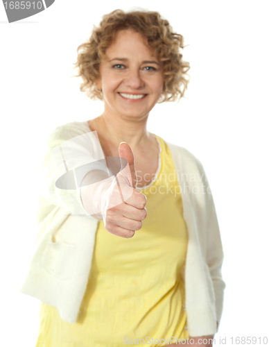 Image of Glamorous woman gesturing thumbs-up