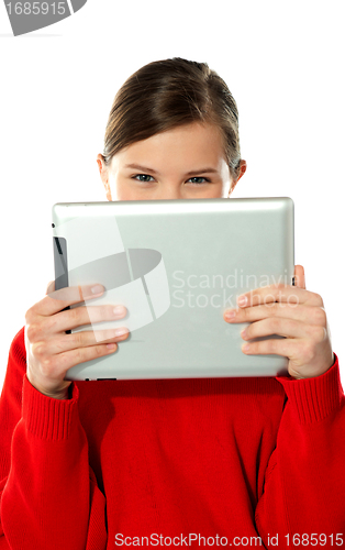 Image of Beautiful girl hiding her face with touch pad