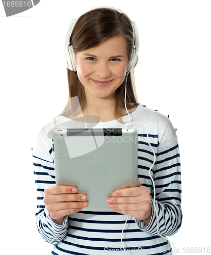 Image of Smiling pretty girl holding i-pad