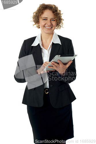 Image of Curly haired corporate woman posing with ipad