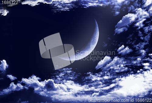 Image of Half of moon in clouds