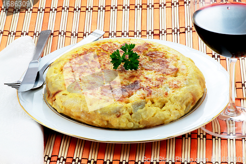 Image of Omelet with potatoes and onion